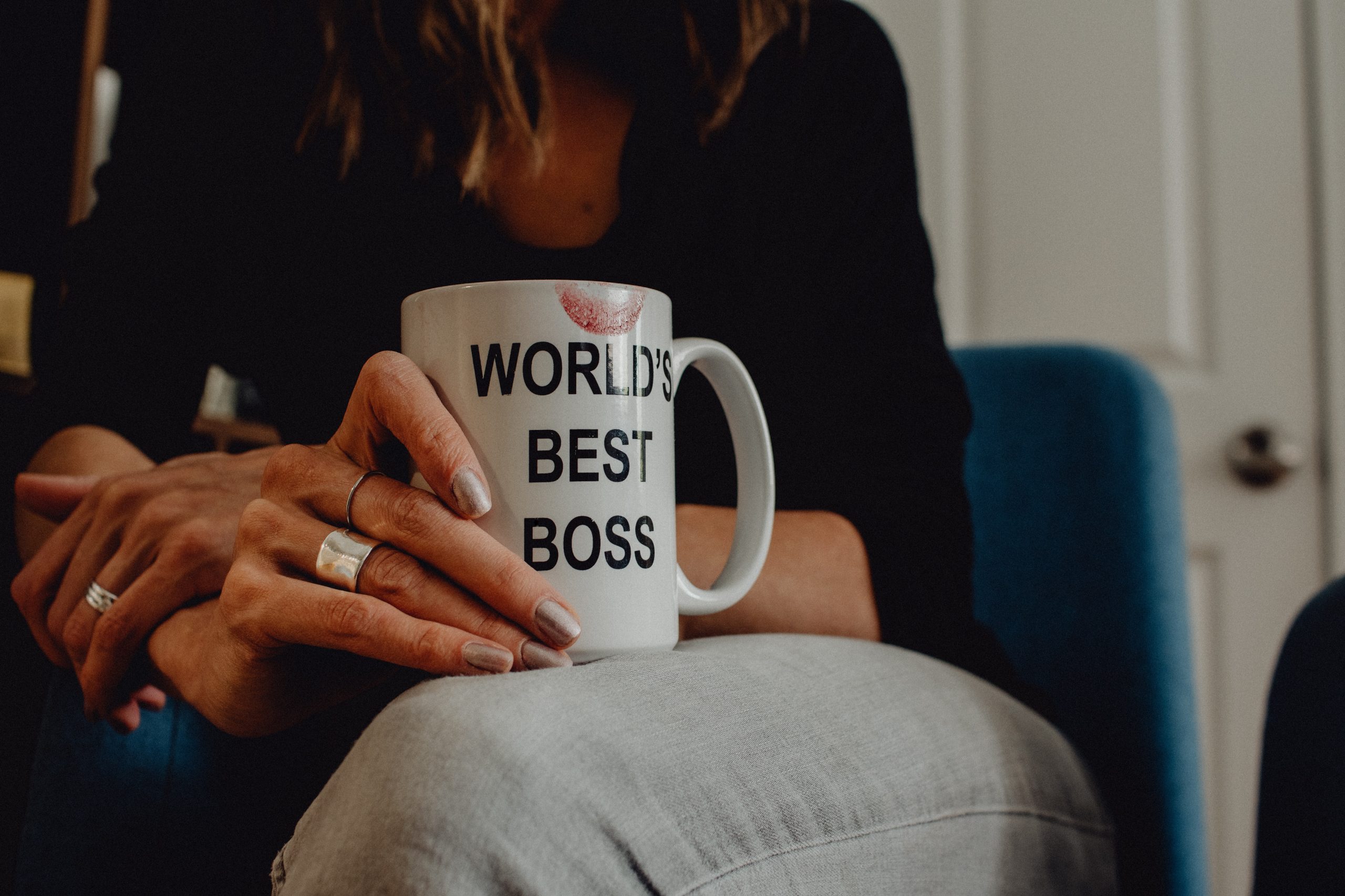 woman holding coffee mug "worlds best boss"